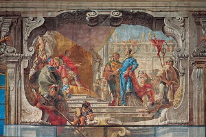 Ein lebendiges und detailliertes Deckengemälde, das eine vielfältige Gruppe von realistisch gestalteten Menschen in traditioneller und moderner Kleidung zeigt, umgeben von Skulpturen und verschiedenen Gegenständen, die eine lebendige Szene schaffen.