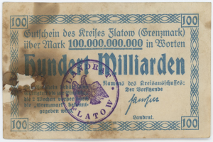 Deutscher Geldschein mit der Aufschrift "Grenzmark 100.000.000" und einem violetten Stempel auf weißem Hintergrund.