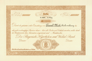 Altes Aktienzertifikat mit goldenem Rand, das ein Porträt eines Mannes und Text zeigt.