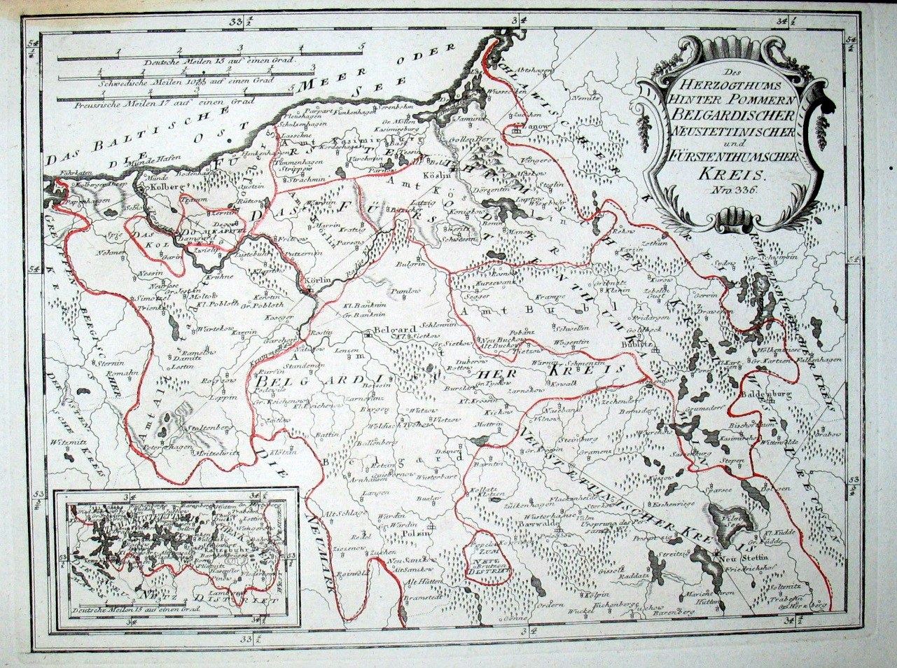 Alte Deutschlandkarte mit roter Linie darauf, auf Papier gedruckt mit handgeschriebenem Text.