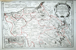 Alte Deutschlandkarte mit roter Linie darauf, auf Papier gedruckt mit handgeschriebenem Text.