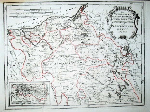 Alte Deutschlandkarte mit roter Linie darauf, auf Papier gedruckt mit handgeschriebenem Text.